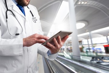 Poster - Close-up Doctor at hospital working with tablet pc