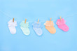 © alurk - Baby socks on blue background.