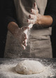 © Freepik - Close-up baker spreading flour on top of dough