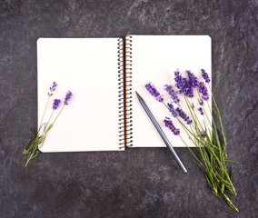 Canvas Print - Mockup of open blank notepad and lavender bouquet