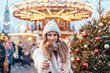 © Alena Ozerova - Girl walking on Christmas Market on Red Square in Moscow