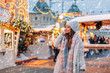 © Alena Ozerova - Girl walking on Christmas Market on Red Square in Moscow