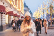 © Alena Ozerova - Girl walking on Christmas Market on Red Square in Moscow