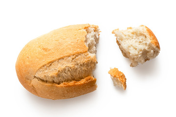 Poster - Broken white french bread roll isolated on white. Top view.