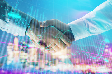 Double exposure of financial chart on cityscape background with two businessmen handshake. Concept of financial analysis and investment opportunities