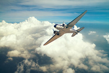 Airplane With Propeller Flying In Blue Sky 