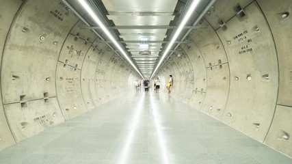 Wall Mural - Time lapse. Samyan Mitrtown tunnel. Empty Sci-Fi modern futuristic cyber room with hallway and lights in smart technology and business concept. Interior design. Metro subway in Bangkok City, Thailand.