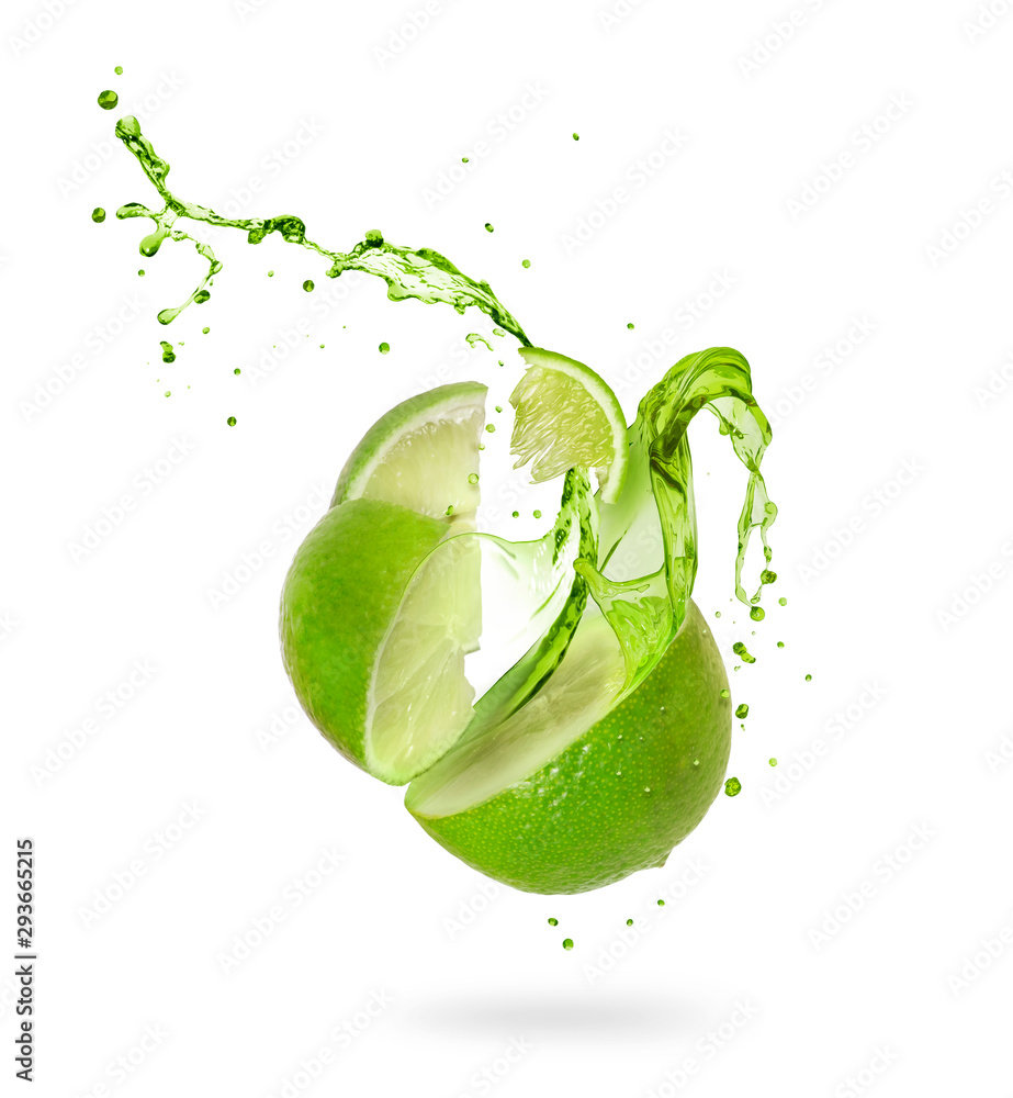 Juice splashes out of a cut lime on a white background - obrazy, fototapety, plakaty 