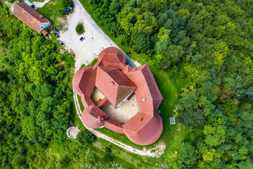 Aerial view of old castle of Trakoscan in green wood in Zagorje, Croatia on sunny summer day