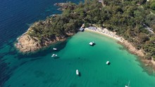 Clear blue water layet sandy beach Cavaliere le Lavandou french riviera aerial shot sunny day tourist destination
