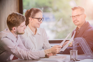 Wall Mural - three businessmen at the meeting to communicate in office