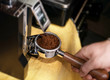 © ange1011 - Macro shot grinding coffee on professional grinder machine