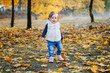 © kaloriya - Little toddler girl in autumn park.