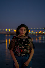 Portrait Of A Woman At Night In The Ocean Cityscape