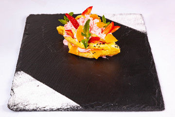 Wall Mural - Dessert with fruit on a black plate