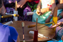 Sacred Drums During Spiritual Singing. A Close Up View During A Traditional Singing Circle Where Participants Gather Round A Mother Drum And Play Traditional Native Music, With Copy Space.