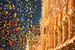 Christmas city landscape. trees with glowing garlands red and golden balls on city street, abstract background. symbol of holiday. winter weekend