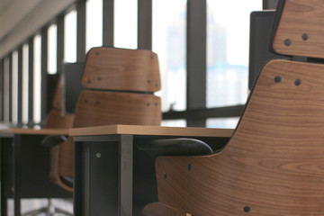 Wall Mural - wooden table desk in office business room with big windows background