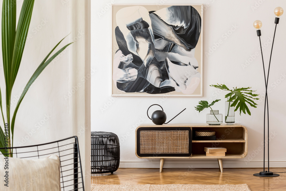 Scandinavian and design home interior of living room with wooden commode, design black lamp, rattan basket, plants and elegant accessories. Stylish home decor. Template. Mock up poster paintings.  - obrazy, fototapety, plakaty 