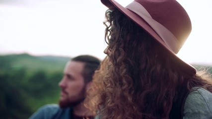 Wall Mural - young tourist couple travellers with hiking in nature, resting. slow motion.