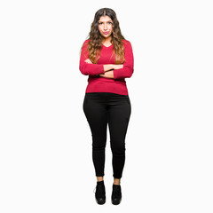 Sticker - Young beautiful woman wearing red sweater skeptic and nervous, disapproving expression on face with crossed arms. Negative person.