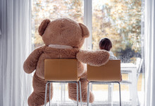 Watching Autumn Rain. Little Boy Sitting With His Big Soft Teddy Bear Friend On Chairs Ion Front Of Window Looking Outside. Fall Lifestyle. Frendship. Seasonal Mood