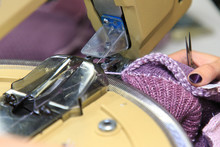 Looping Machine Operator Working In A Knitwear Factory