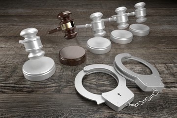 3D law, crime, verdict concept - handcuffs, wooden background