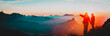 Leinwandbild Motiv mother and son travel in mountains at sunset, panorama