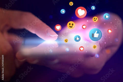 Cuadros en Lienzo Finger touching phone with social media concept and dark background