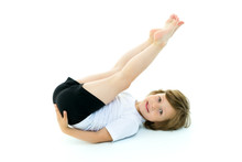 Charming Little Girl Doing Gymnastic Exercises In The Studio On