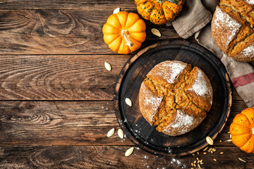 Canvas Print - Pumpkin bread. Homemade rye wholemeal yeast-free bread with pumpkins