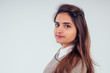 © yurakrasil - beautuful indian woman wearing white shirt with collar and sweater with brown black hair in studio white background