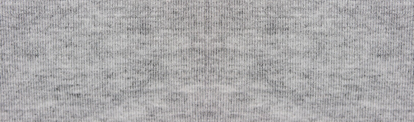 Grey fabric background. Empty light gray sweater texture. Seamless sew pattern 