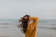 © Javier Pardina/Stocksy - young woman relaxing on the beach