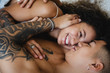 © Michela Ravasio/Stocksy - Two happy lovers embraced in bed