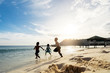 © Santi Nunez/Stocksy - Group of cute Asian kids having fun in the beach