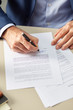 © 365mm/Stocksy - Man putting personal signature on paper