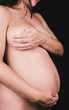 © Sky-Blue Images/Stocksy - Anonymous detail of pregnant woman