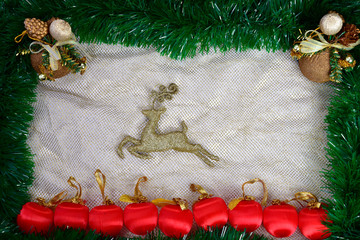 Winter holiday background. Border with Christmas tree branches and ornaments isolated on whitch. Fir needles garland, frame with streamers. Great for New year cards, banners, headers, party posters.