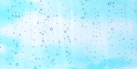 Wall Mural - water drops on long window glass in a raining day