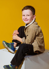 Wall Mural - portrait of a little fashionable boy in the studio