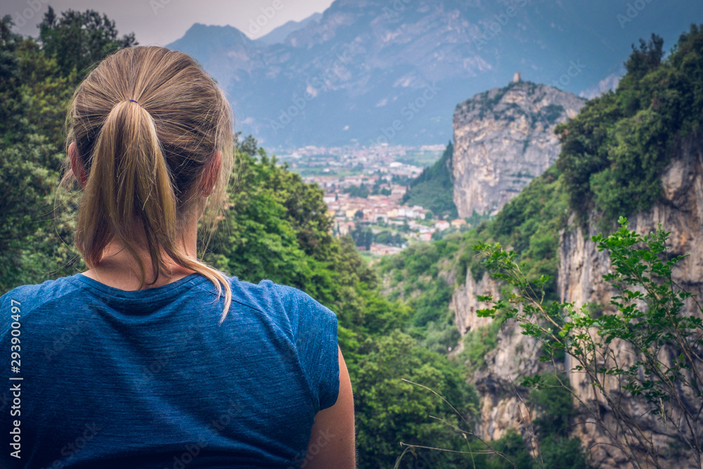 Climbing area, Massone, Arco, Italy. Climber - woman is looking to the valley. - obrazy, fototapety, plakaty 
