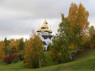 Orthodox church building on a hill, autumn landscape