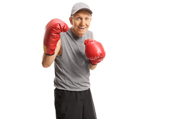 Canvas Print - Elderly man training boxing