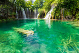 Fototapeta Góry - Pure fresh water rushing into an azure coloured lake at the Plitvice Lakes National Park, Plitvička Jezera, Croatia