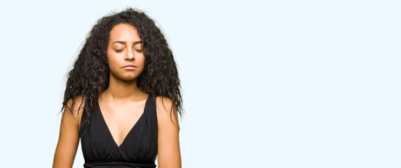 Canvas Print - Young beautiful girl with curly hair wearing fashion skirt with hand on stomach because nausea, painful disease feeling unwell. Ache concept.