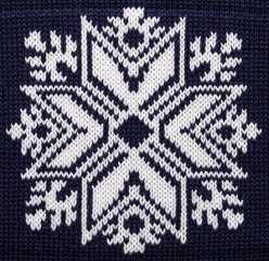 Wall Mural - White knitted snowflake ornament on blue Christmas sweater