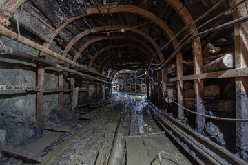Gold mine ore shaft tunnel with rails