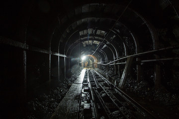 Gold mine ore shaft tunnel with rails